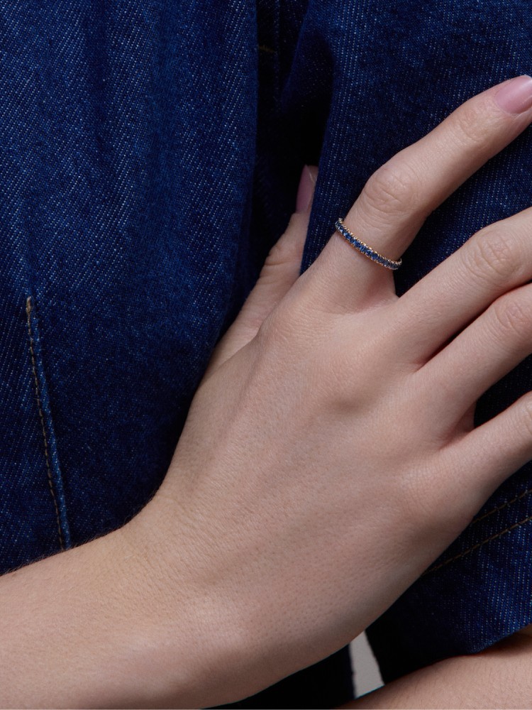 Minnow three quarter medium blue sapphire eternity ring