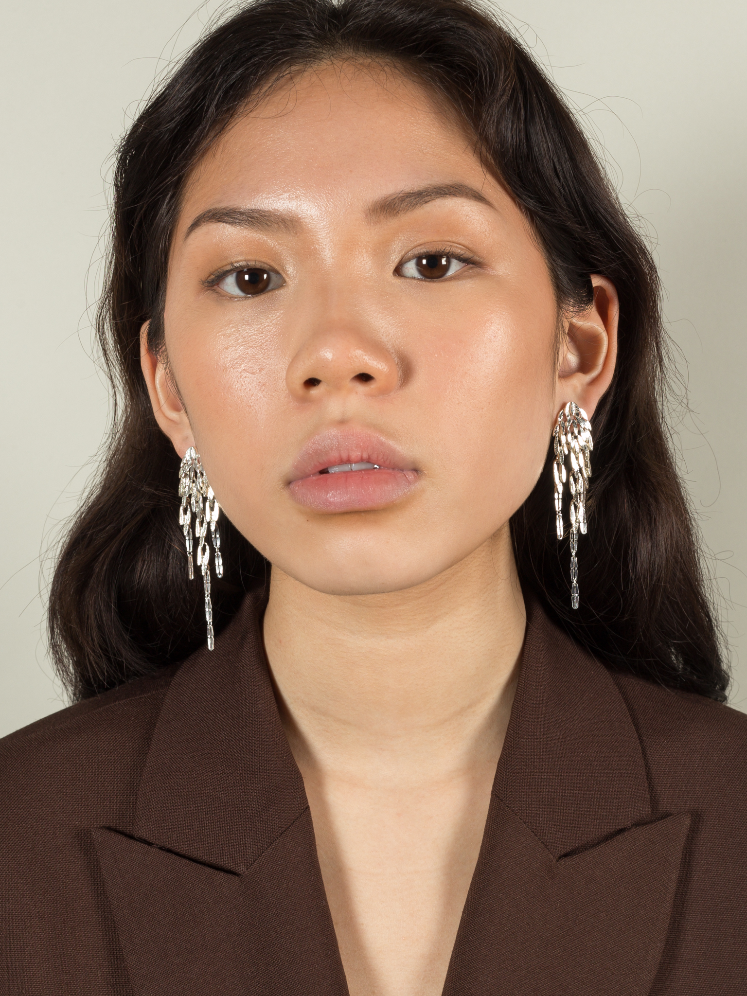 Stud earrings with dangling leaves photo